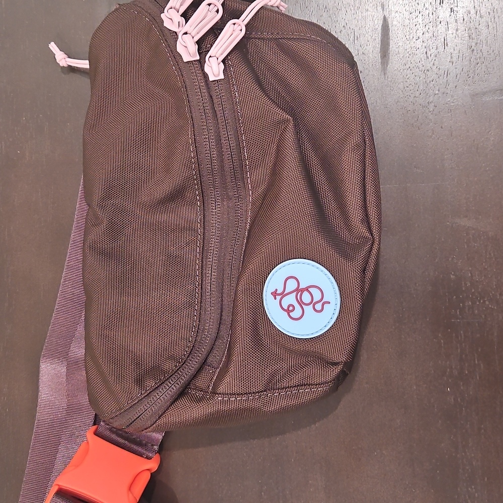 Elegant Brown Crossbody Bag with Red Accents